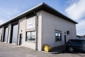 Exterior of building featuring Daikin air-to-air system, new windows, doors and fittings
